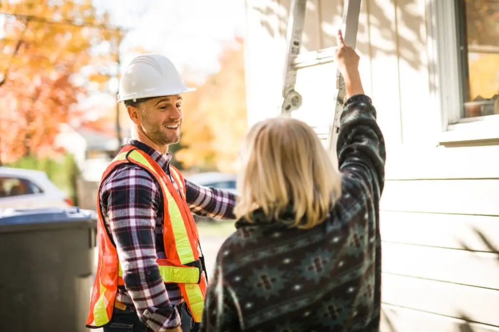 man with hard hat talking with customer